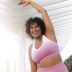 front-view-smiley-woman-exercising-scaled.jpg